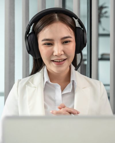 Female call center provides information to a customer calling for help, Contact us, Service with a beautiful and friendly voice, Long distance communication, Talk using headphones or headsets.